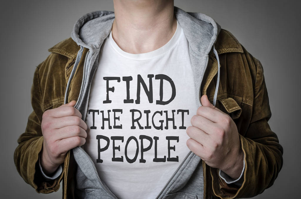 Man showing Find the right people tittle on t-shirt. Human resou